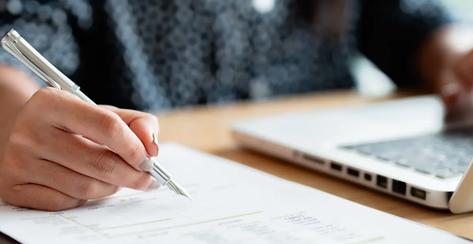 Woman calculating monthly expenses, taxes and interest calculate at home..