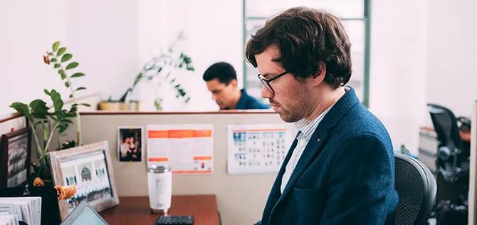 man working in cubicle office