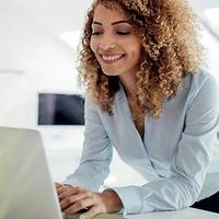 A young female financial professional reviewing client financial data