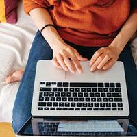 Overhead view of woman working on laptop