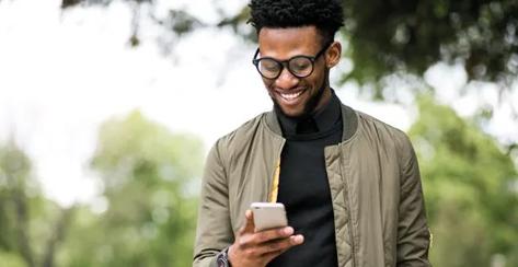 african american man using phone; Shutterstock ID 641303035; Purchase Order: Creative Services; Job: Creative Services; Client/Licensee: Voya Financial; Other: AG