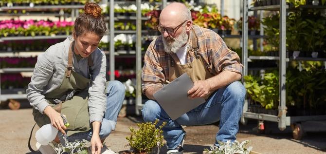 Garden Center employee getting guidance from owner 