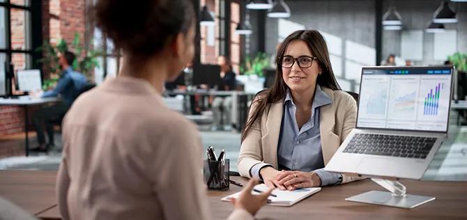 Corporate Consultant Advising Young African American Woman On Financial Planning.