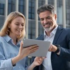 business woman and man looking at a laptop