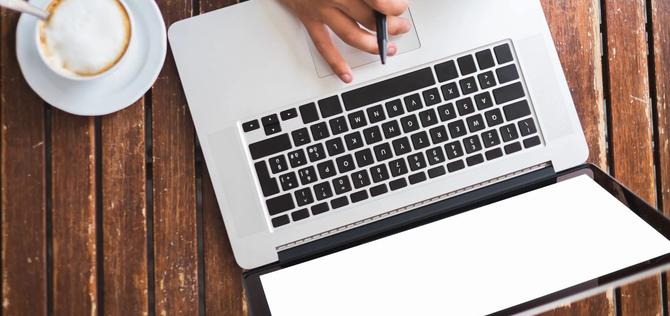 *Duplicate* Woman's hand using computer on desk