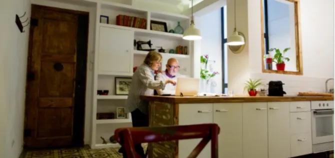 Older couple at home looking at computer screen