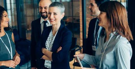 Coworkers smiling during a group exercise