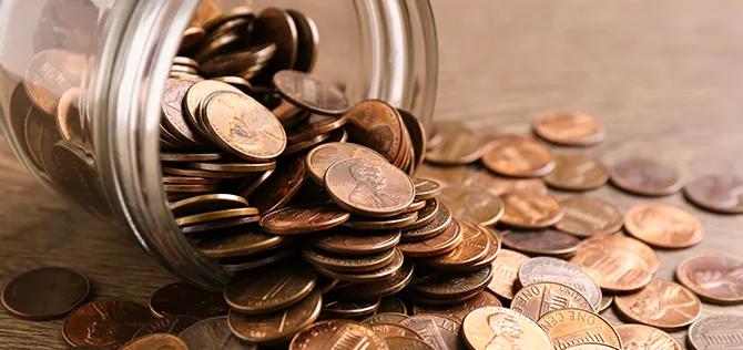 Pennies spilling from a jar